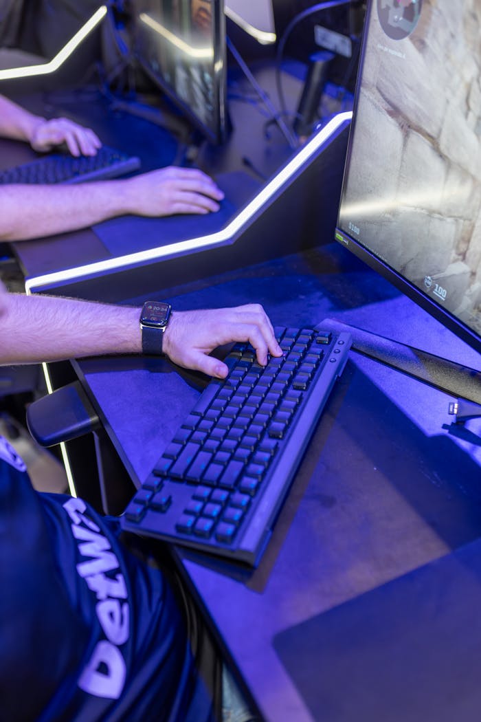 Close-up shot of a gaming setup with keyboard and screen during an e-sports event.